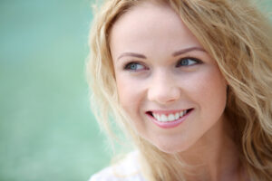 Portrait of beautiful blond smiling woman
